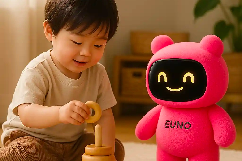 jeune enfant jouant a un jeux en bois avec son compagnon robot euno rose souriant