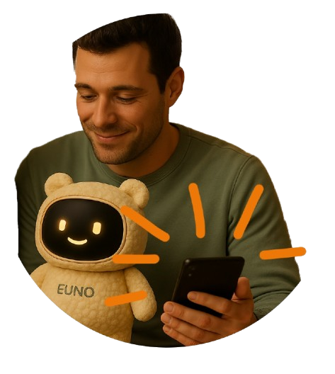 un père qui programme son robot euno avec l'application mobile avec euno sur les genoux